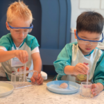 2 boys doing science experiment at Acorn Playhouse, an academic educational playhouse in Southside Hong Kong.