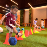 children playing soccer at ACorn PLayhouse during camp
