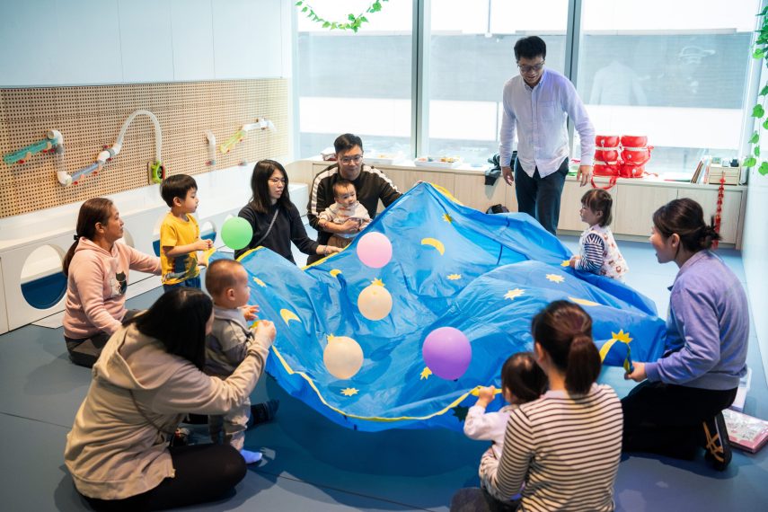 Parents and children bonding over a hands-on activity at Acorn Playhouse in Southside Hong Kong.